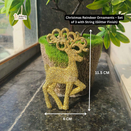 Gold glitter reindeer ornament on a green plant pot with measurements indicated.