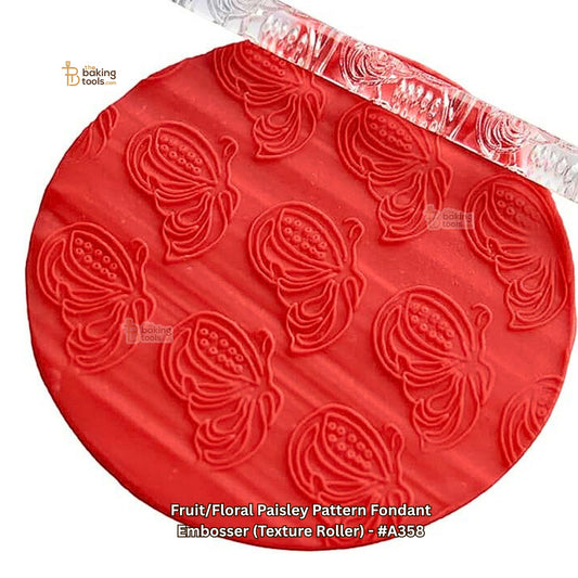 Red fondant embosser with fruit/floral paisley pattern on a white background
