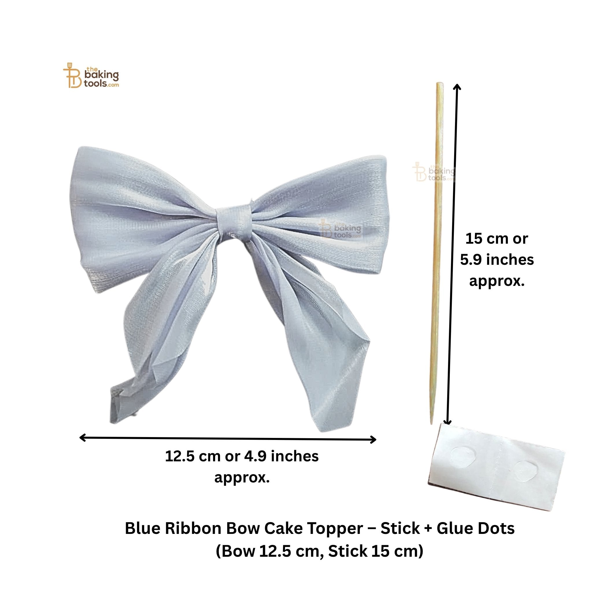 Blue ribbon bow cake topper with stick and glue dots on a white background