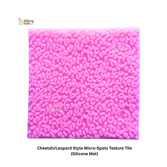 Pink silicone mat with cheetah/leopard style micro-spots texture on a white background