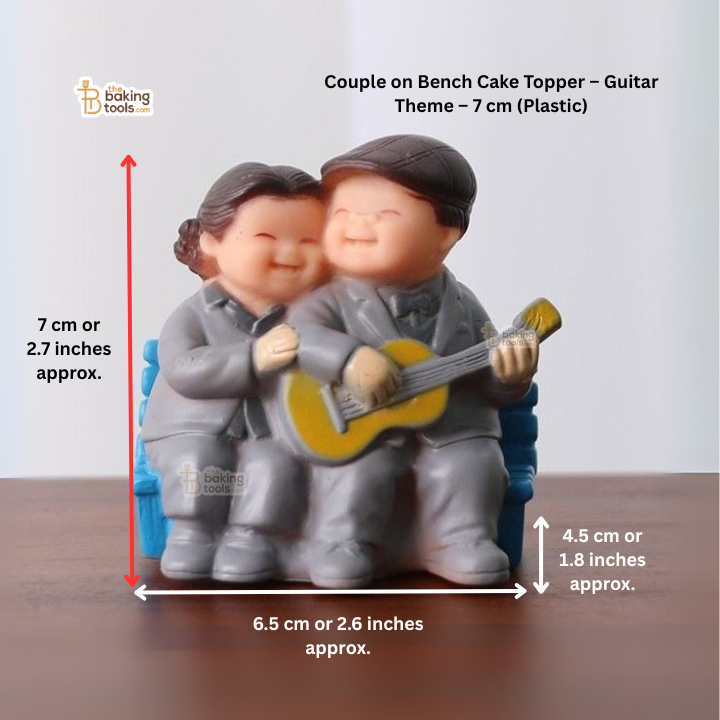 Couple on bench cake topper with guitar, shown with measurements.