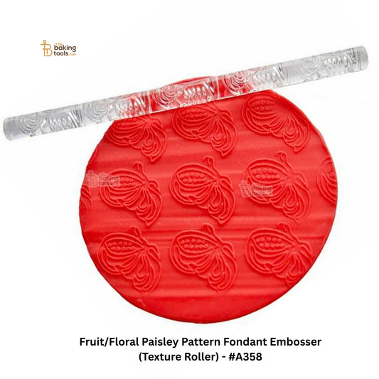 Red fondant embosser with floral paisley pattern on a white background