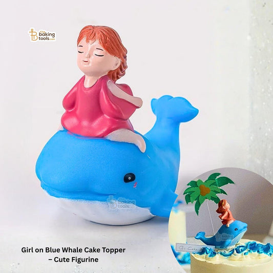 Cake topper with a girl riding a blue whale on a white background