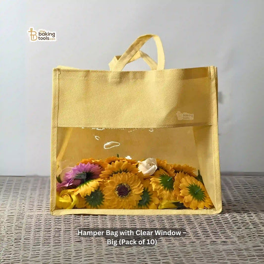 Hamper Bag with Clear Window containing flowers on a textured surface. Big in size, 12 by 14 by 5 inches, and it's a pack of 10 pcs