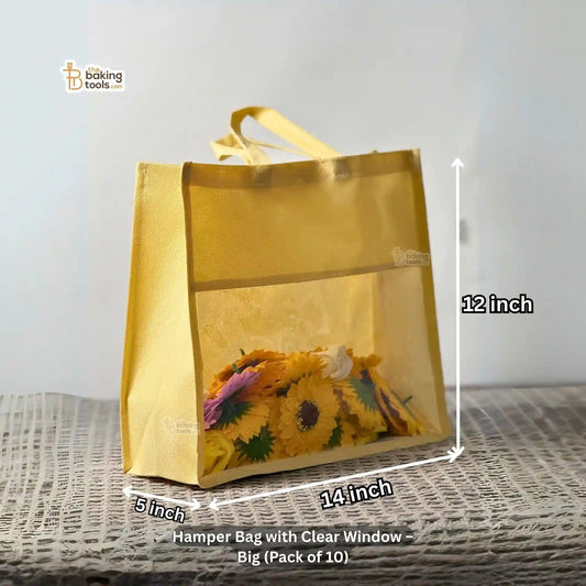 Hamper bag with clear window and floral design, shown with measurements 12 by 14 by 5 inches, on a textured surface.