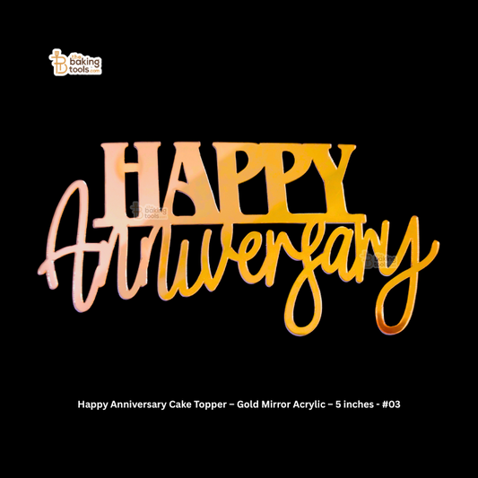 Gold mirror acrylic 'Happy Anniversary' cake topper on a black background