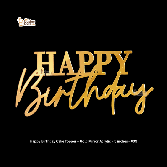 Gold 'Happy Birthday' cake topper on a black background