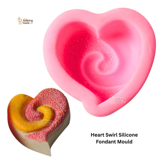 Heart swirl silicone fondant mould with a baked good shaped like it on a white background