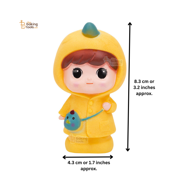 Toy figure in a yellow raincoat with dimensions indicated on a white background