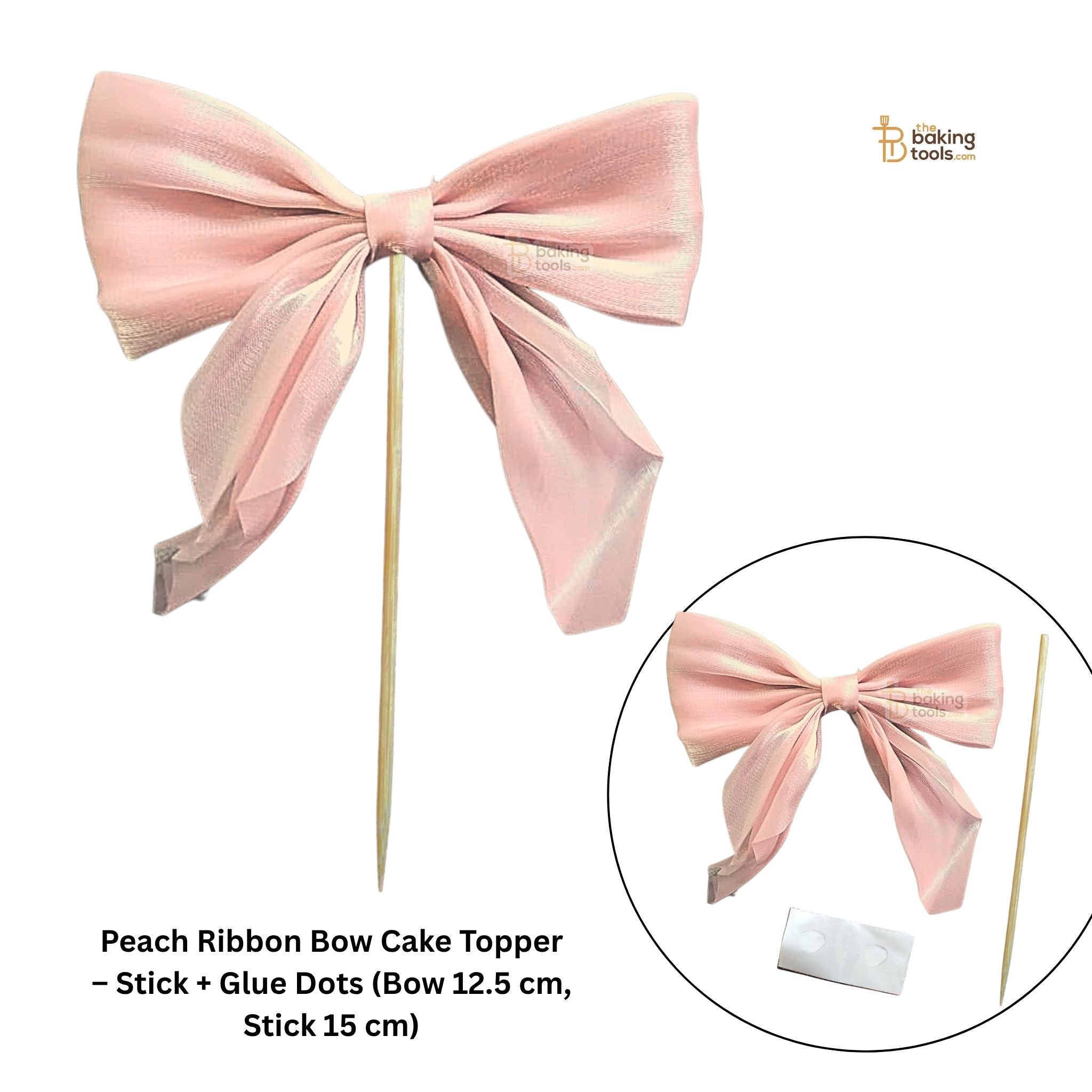 Peach ribbon bow cake topper with stick and glue dots on a white background