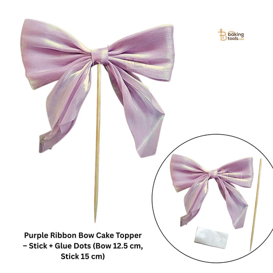 Purple ribbon bow cake topper with stick and glue dots on a white background