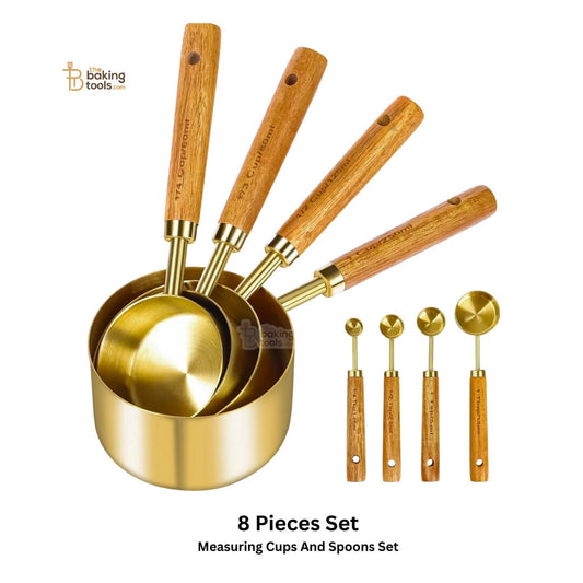 Set of gold measuring cups and spoons with wooden handle
