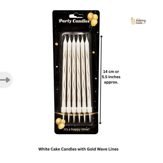 white cake candles with gold wave line pattern _ The Baking tools