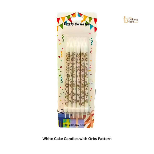 white cake candles with orbs pattern