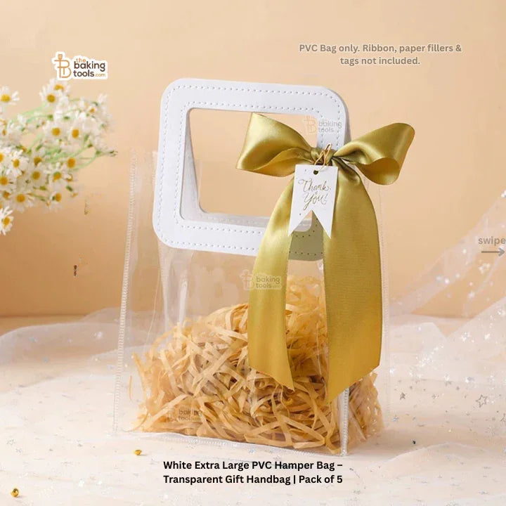 White extra large PVC hamper bag with a gold ribbon and tag on a beige background