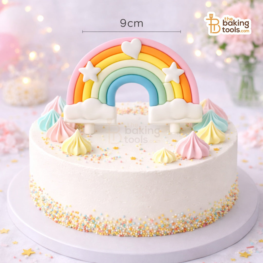 Decorative cake with a rainbow and cloud design on a light background.