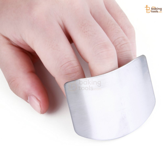 Metallic ring being worn on a finger with 'Baking Tools' branding.